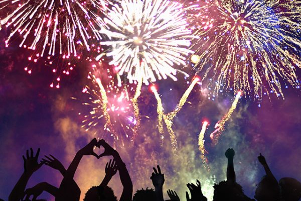 Crowd of people enjoying firework display