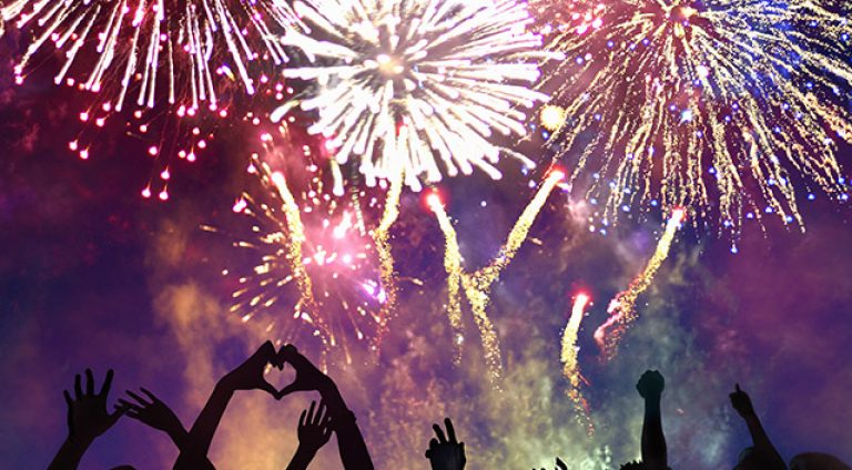 Crowd of people enjoying firework display