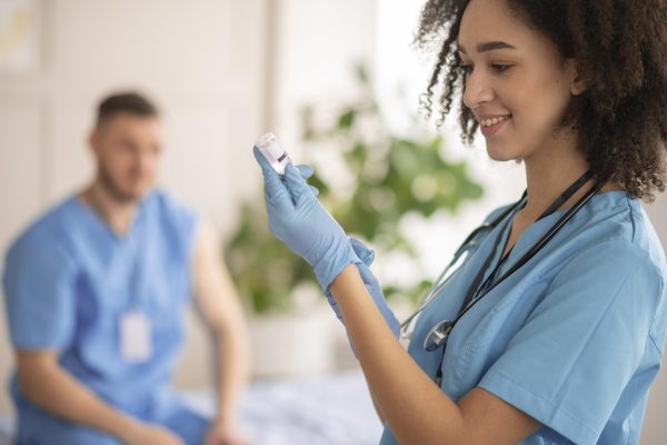 female-doctor-preparing-vaccination-her-colleague