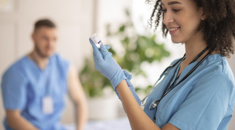 female-doctor-preparing-vaccination-her-colleague