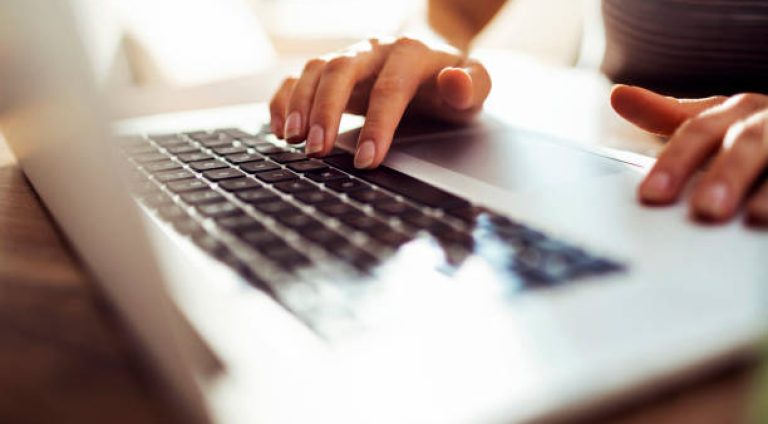 Close up of a young woman working from home