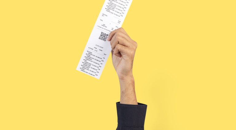 Hand holding receipt for shopping campaign
