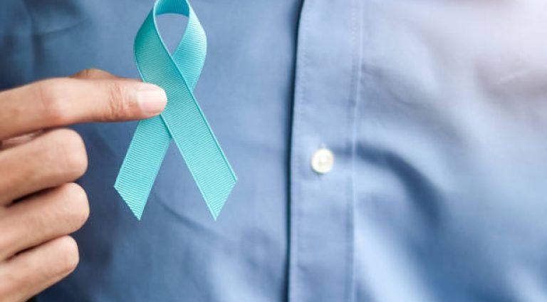 Prostate Cancer Awareness, Man holding light Blue Ribbon for supporting people living and illness. Men Healthcare and World cancer day concept
