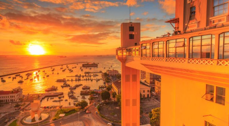 A wide picture of the sunset in the Lacerda's Lift at Bahia, Brazil, taken in a bright and beautiful day. The first popular elevator in Brazil. Colorful and satured taken with a Canon 6D.