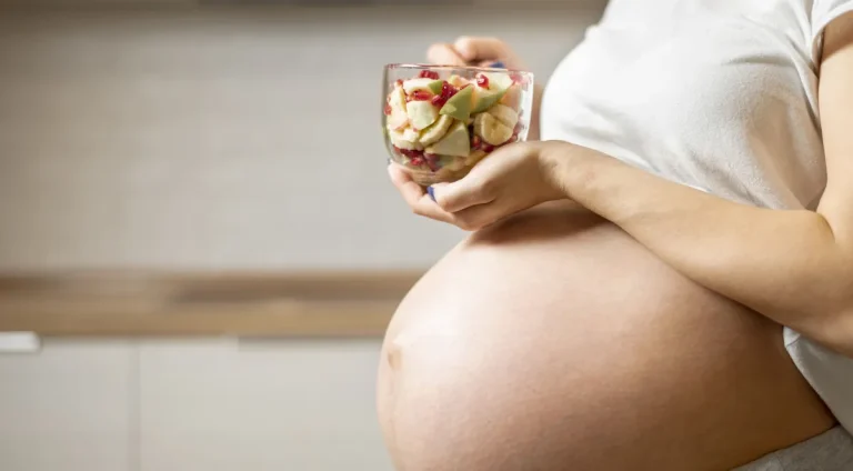 pregnant-woman-hands-holding-delicious-salad